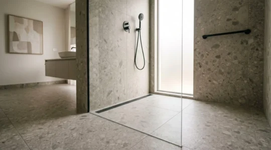 Barrier-free Italian shower with linear drain and textured anti-slip flooring in modern accessible bathroom